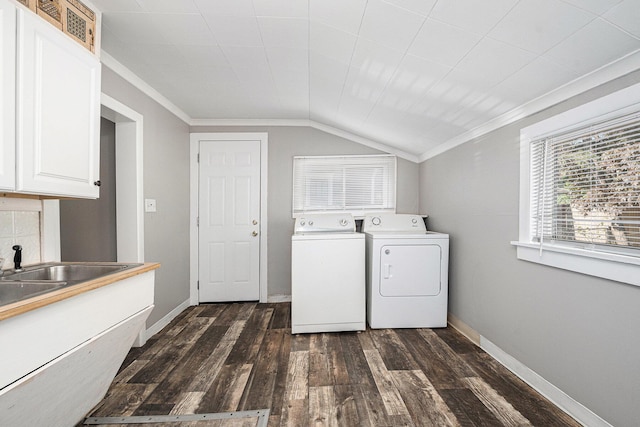 clothes washing area with washer and clothes dryer, dark wood-style floors, cabinet space, crown molding, and baseboards