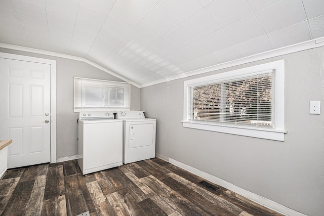 laundry area featuring separate washer and dryer, dark wood-style floors, baseboards, and crown molding