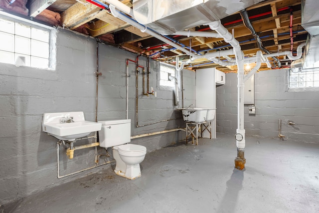 below grade area featuring a sink and plenty of natural light