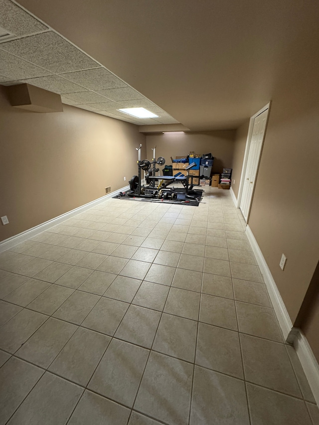 41315 Carriage Hill Dr, Novi, MI 48375 - finished basement with tile patterned flooring, baseboards, and a paneled ceiling