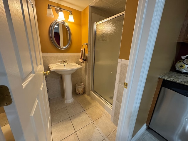 41315 Carriage Hill Dr, Novi, MI 48375 - bathroom featuring tile walls, tile patterned floors, a shower stall, and a wainscoted wall