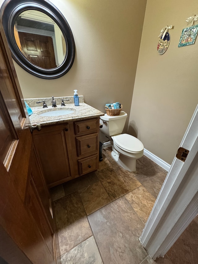 41315 Carriage Hill Dr, Novi, MI 48375 - half bath with toilet, vanity, stone finish flooring, and baseboards
