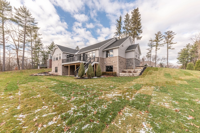 5535 W Huron River Dr, Dexter, MI 48130 - back of property featuring stairway, a deck, a lawn, brick siding, and central air condition unit