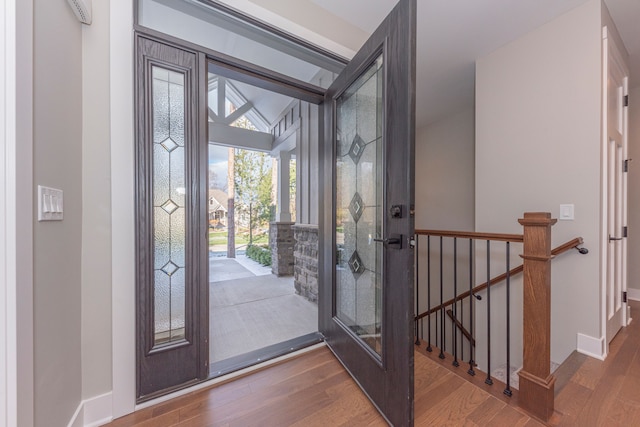 5535 W Huron River Dr, Dexter, MI 48130 - foyer entrance with wood finished floors, healthy amount of natural light, and baseboards