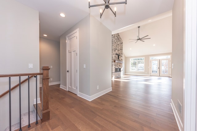5535 W Huron River Dr, Dexter, MI 48130 - corridor with an upstairs landing, wood finished floors, baseboards, vaulted ceiling, and a chandelier