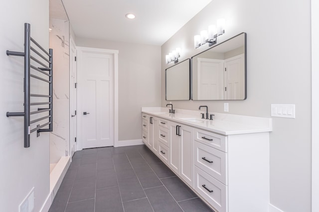 5535 W Huron River Dr, Dexter, MI 48130 - full bath featuring double vanity, baseboards, tile patterned floors, recessed lighting, and a shower