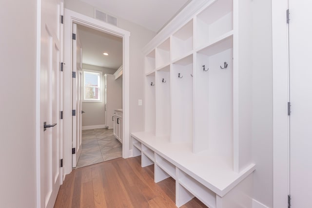 5535 W Huron River Dr, Dexter, MI 48130 - mudroom featuring light wood-style flooring and baseboards