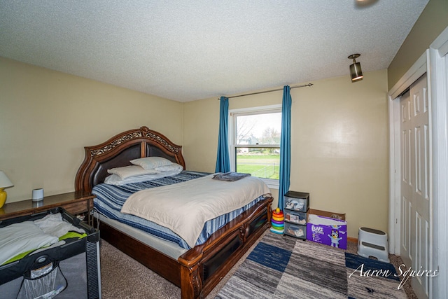 2721 Rum Creek Dr SE, Kentwood, MI 49508 - carpeted bedroom with a closet and a textured ceiling