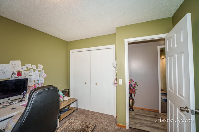 2721 Rum Creek Dr SE, Kentwood, MI 49508 - carpeted home office with a textured ceiling and baseboards