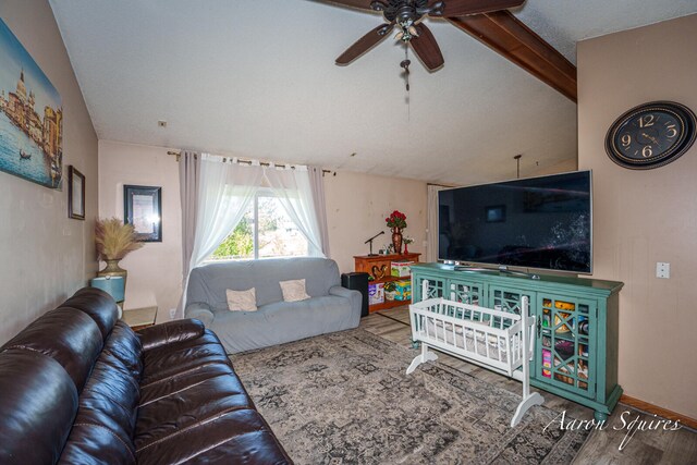 2721 Rum Creek Dr SE, Kentwood, MI 49508 - living area with a ceiling fan, wood finished floors, and vaulted ceiling