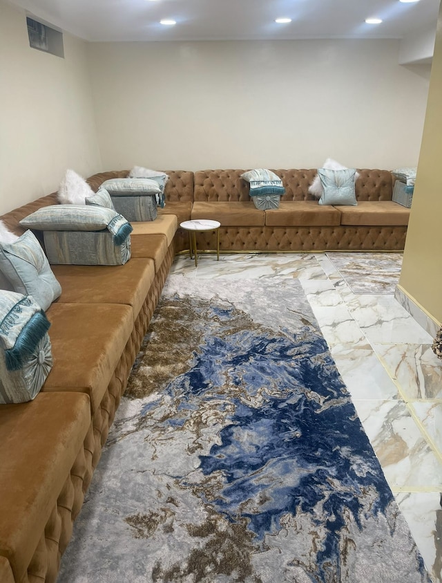 living room with marble finish flooring and recessed lighting