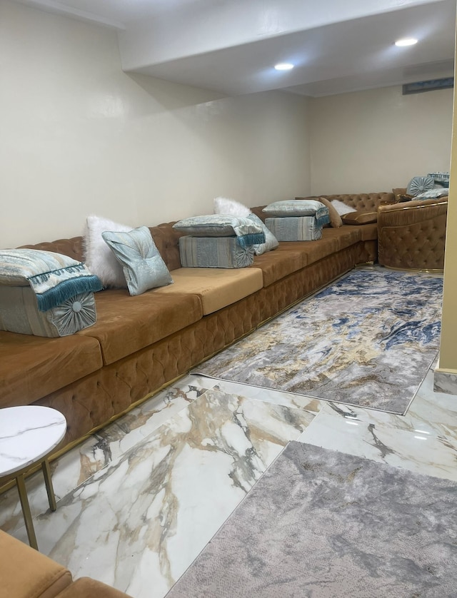 living area with marble look tile flooring and recessed lighting