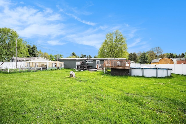 rear view of property featuring a wooden deck