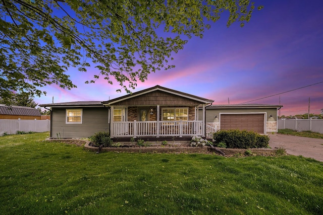 single story home featuring a porch, driveway, an attached garage, and stone siding