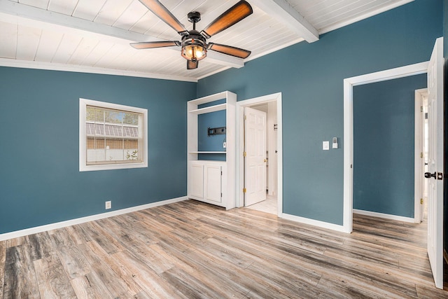 unfurnished bedroom featuring wood ceiling, beam ceiling, baseboards, wood finished floors, and ceiling fan