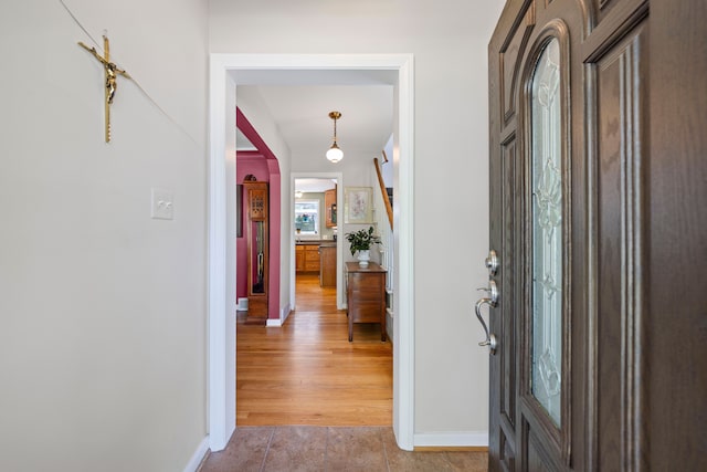 foyer entrance with baseboards