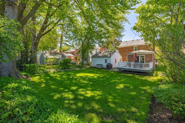 view of yard with a wooden deck