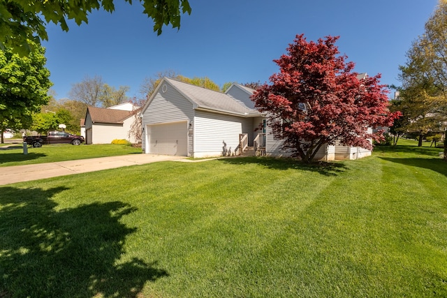 454 Woodland Dr, Saline, MI 48176 - view of side of home with a yard, an attached garage, and concrete driveway