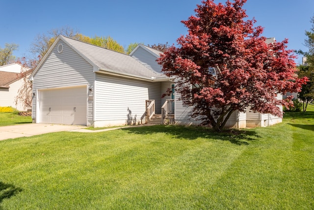 454 Woodland Dr, Saline, MI 48176 - view of front of house featuring a front lawn, an attached garage, concrete driveway, and a shingled roof