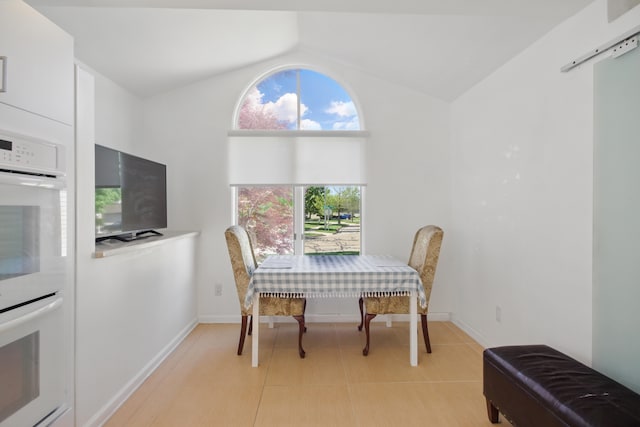 454 Woodland Dr, Saline, MI 48176 - dining area featuring lofted ceiling and baseboards