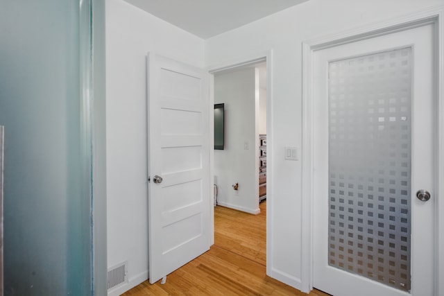 454 Woodland Dr, Saline, MI 48176 - hallway with light wood-style flooring and baseboards