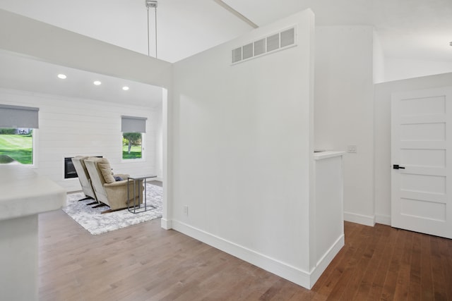 454 Woodland Dr, Saline, MI 48176 - corridor featuring wood finished floors, baseboards, high vaulted ceiling, and recessed lighting