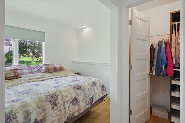 454 Woodland Dr, Saline, MI 48176 - bedroom featuring wood finished floors, a closet, a spacious closet, and recessed lighting