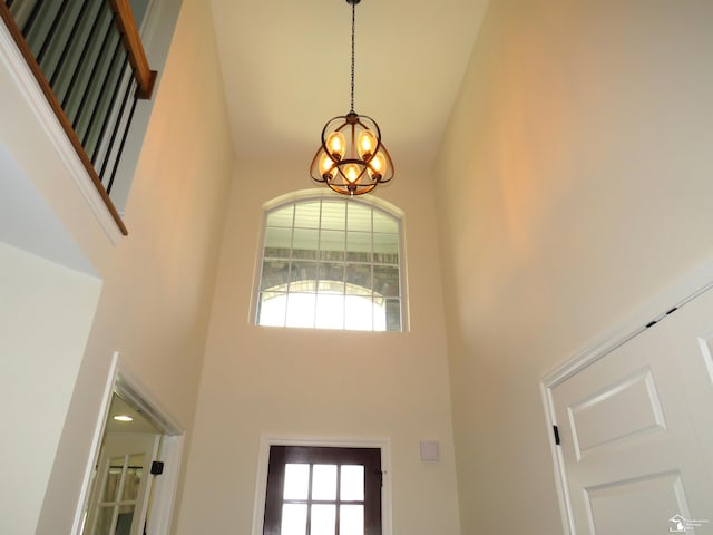 465 Corinth Cir, Dundee, MI 48131 - foyer entrance featuring a high ceiling, a chandelier, and healthy amount of natural light