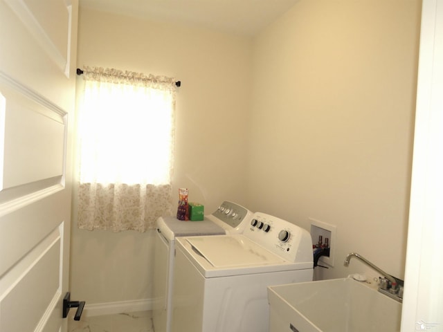 465 Corinth Cir, Dundee, MI 48131 - clothes washing area with washing machine and dryer and marble look tiles