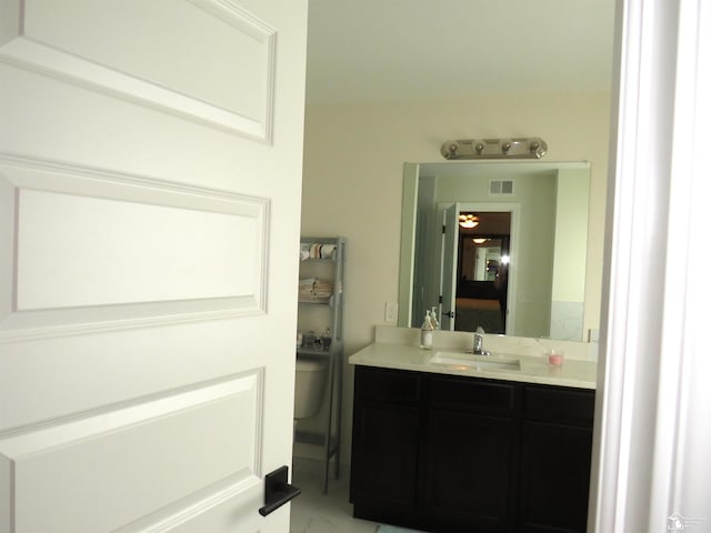 465 Corinth Cir, Dundee, MI 48131 - bathroom featuring toilet, vanity, and marble look tile flooring