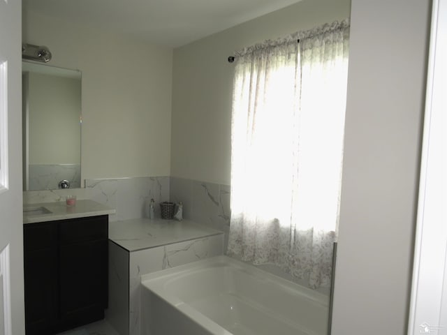 465 Corinth Cir, Dundee, MI 48131 - bathroom featuring a garden tub and vanity