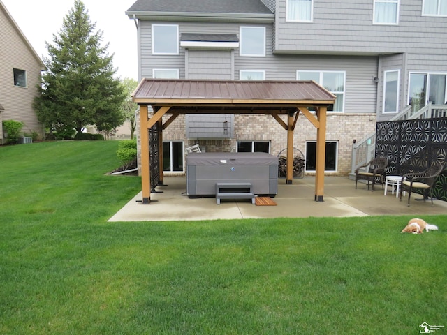 465 Corinth Cir, Dundee, MI 48131 - rear view of property featuring a hot tub, a patio area, a yard, and a gazebo