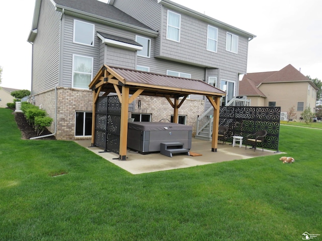 465 Corinth Cir, Dundee, MI 48131 - back of property featuring a hot tub, a patio, brick siding, and a gazebo
