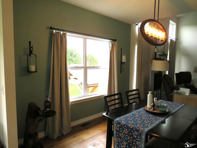465 Corinth Cir, Dundee, MI 48131 - dining room featuring baseboards, light wood-type flooring, and a chandelier