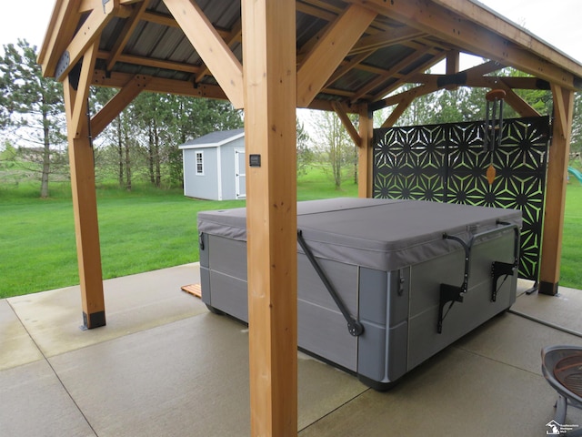 465 Corinth Cir, Dundee, MI 48131 - view of patio / terrace with a hot tub, a gazebo, an outbuilding, and a storage unit