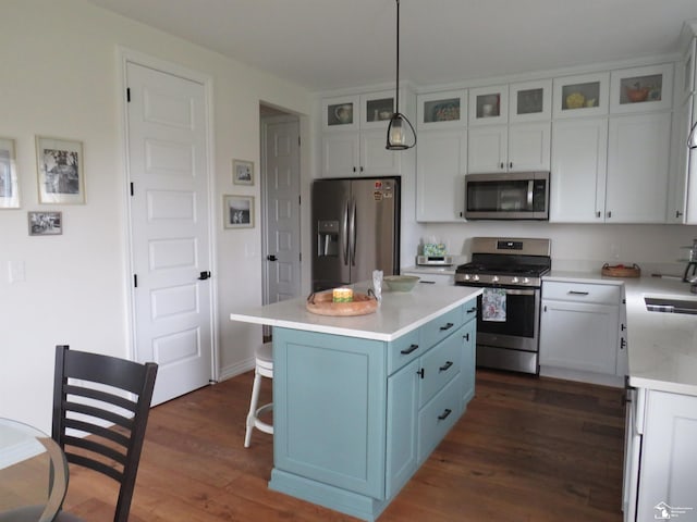 465 Corinth Cir, Dundee, MI 48131 - kitchen featuring appliances with stainless steel finishes, dark wood-style flooring, white cabinetry, a kitchen island, and a sink