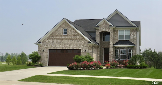 465 Corinth Cir, Dundee, MI 48131 - craftsman inspired home featuring concrete driveway, a front lawn, and brick siding