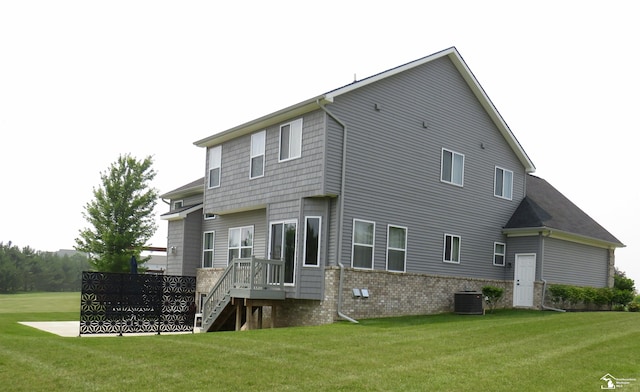465 Corinth Cir, Dundee, MI 48131 - rear view of property with a yard and central air condition unit