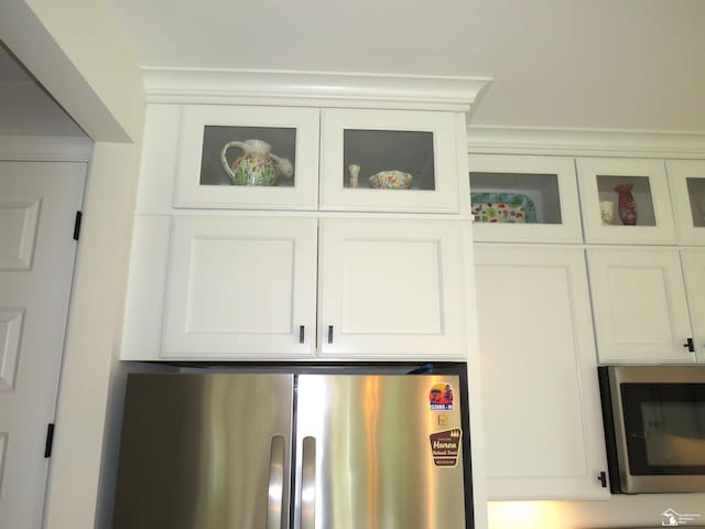 465 Corinth Cir, Dundee, MI 48131 - kitchen view of stainless steel appliances, glass insert cabinets, and white cabinets