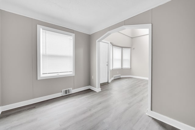 empty room with wood finished floors and baseboards