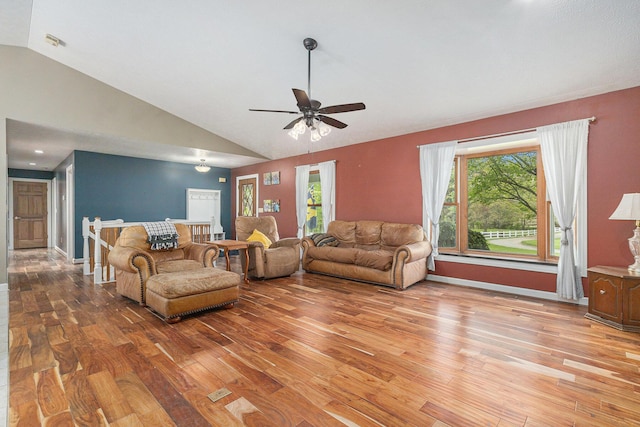 2269 W Liberty Rd, Clarklake, MI 49234 - living room featuring light wood-style floors, lofted ceiling, ceiling fan, and baseboards