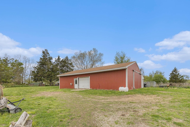 2269 W Liberty Rd, Clarklake, MI 49234 - rear view of property with a pole building, a yard, an outbuilding, and a detached garage