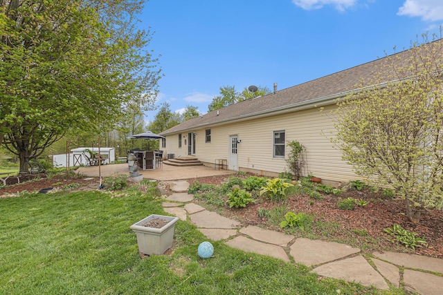 2269 W Liberty Rd, Clarklake, MI 49234 - rear view of property featuring a patio and a yard