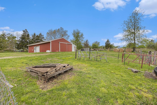 2269 W Liberty Rd, Clarklake, MI 49234 - view of yard featuring a pole building, a garage, and an outbuilding