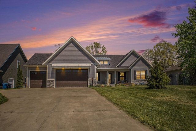 6927 Drumlin Dr, Zeeland, MI 49464 - view of front of home featuring driveway, a front yard, an attached garage, board and batten siding, and stone siding