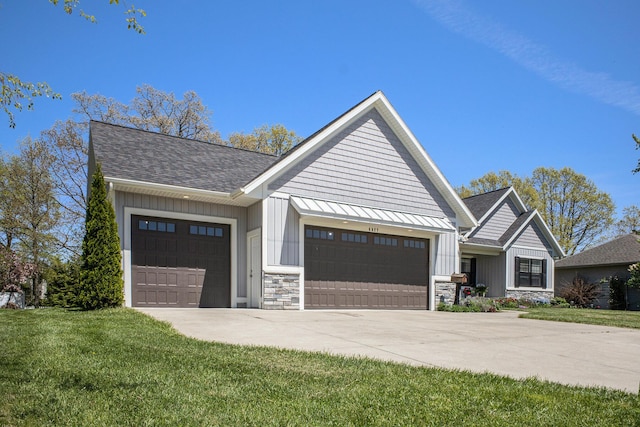 6927 Drumlin Dr, Zeeland, MI 49464 - view of front of property with an attached garage, concrete driveway, roof with shingles, stone siding, and a front yard