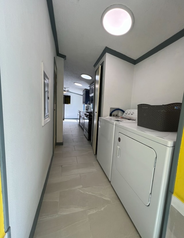 7368 Clear Lake Rd, Imlay City, MI 48444 - washroom featuring separate washer and dryer, baseboards, and a textured ceiling