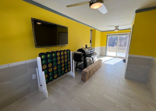 7368 Clear Lake Rd, Imlay City, MI 48444 - living room with ceiling fan and a wainscoted wall