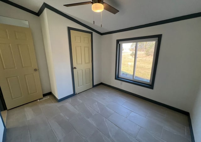 7368 Clear Lake Rd, Imlay City, MI 48444 - unfurnished bedroom featuring crown molding, baseboards, ceiling fan, and lofted ceiling