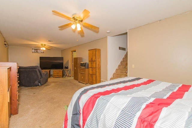 bedroom with carpet flooring and a ceiling fan